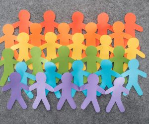 colorful paper cut figures of lgbt pride on grey background, lgbt concept