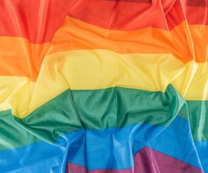 top view of creased lgbt rainbow flag, lgbt concept